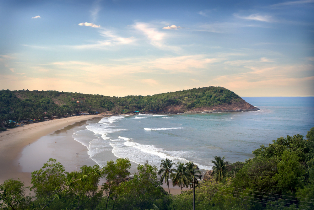 Top things to do in Gokarna, India, including exploring serene beaches like Om and Kudle, trekking to Paradise Beach, witnessing breathtaking sunsets, and enjoying peaceful temple visits.