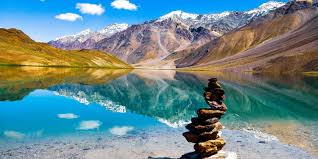 Stunning landscape of Spiti Valley in Himachal Pradesh, India, featuring rugged mountains, ancient monasteries perched on cliffs, and winding roads—a remote and breathtaking destination for adventure seekers.